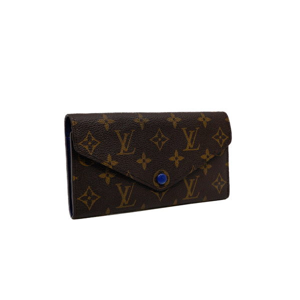 Sarah tri-fold long flap wallet in monogram/blue