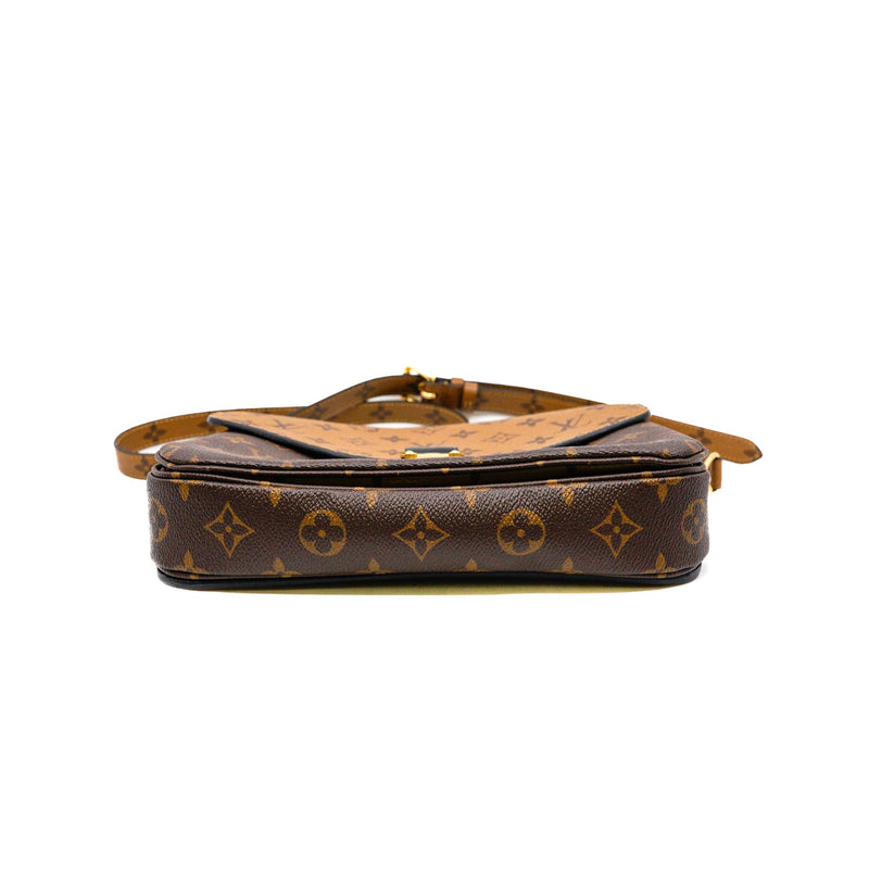 pochette metis in monogram reverse canvas ghw