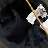 thumbnail hat with small H logo in nylon dark green