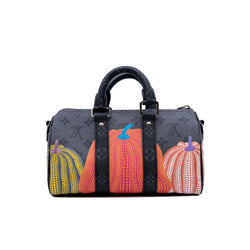 LVxYK keepall pumpkin in Eclipse Reverse canvas - L'UXE LINK