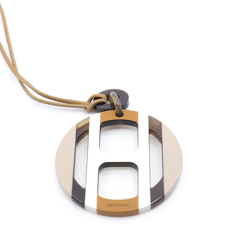 white h in a circle necklace